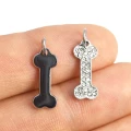 Kość z cyrkoniami ok. 20x7mm [zawieszka, stal]