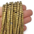 Hematyt jasne złoto matowa kostka 4x4mm [sznur 40cm]