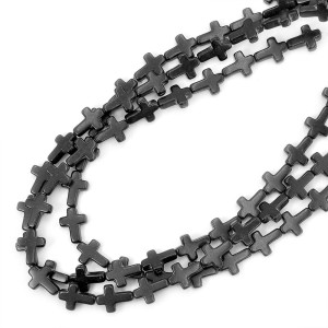 Howlit syntetyczny czarny krzyż ok. 12x16mm
