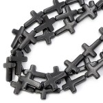 Howlit syntetyczny czarny krzyż ok. 24x18mm 