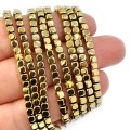 Hematyt jasne złoto kostka ok. 3x3mm [obłe rogi]