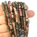 Rodonit różowo czarny patyczek ok. 4x14mm