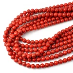 Howlit syntetyczny czerwony kula gładka ok. 8mm