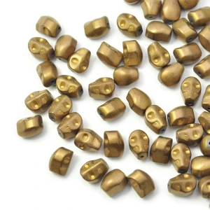 Czaszka matowa miedziana ok. 8x6mm [przekładka hematyt]