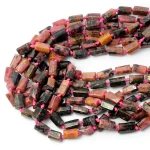 Rodonit różowo czarny walec ok. 9-14x5-8mm