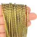 Hematyt jasne złoto matowy walec ok. 2x4mm
