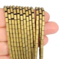 Hematyt jasne złoto matowy walec ok. 3x5mm