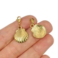 Zawieszka z zapięciem muszla płaska ok. 19x15mm [zawieszka, stal, kolor złoty PVD]