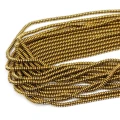 Kamienie w formie drobnych oponek hematytu w kolorze złotym, w rozmiarze ok. 3x1mm.
