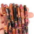 Rodonit walec nieregularny szlifowany ok. 15-30x6-7mm
