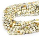Opal blady żółty moneta fasetowana ok. 6,5mm