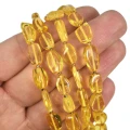 Bursztyn żółty nieregularna bryłka gładka ok. 8,5-13,5x3-5mm