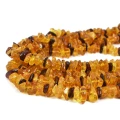Bursztyn  pomarańczowo żółto brązowy sieczka ok. 8-15x3-4,5mm