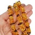 Bursztyn  pomarańczowo żółto brązowy sieczka ok. 8-15x3-4,5mm